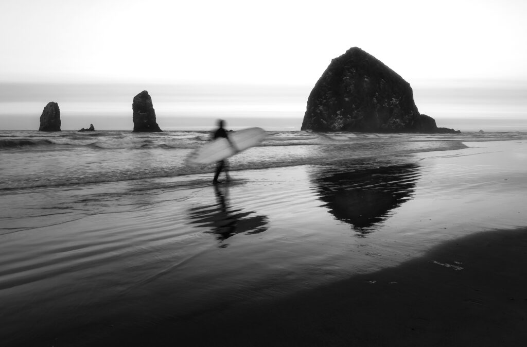 Surfer at Haystack Rock